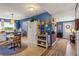 Kitchen and Hallway feature lovely blue walls, tile flooring and decor accents at 2805 Olavet Ct, Valrico, FL 33596