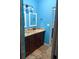 Bright bathroom with dual sinks, granite countertop, and tile flooring at 2903 N 16Th St, Tampa, FL 33605