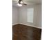 Bedroom featuring hardwood flooring and a window providing natural light at 2903 N 16Th St, Tampa, FL 33605