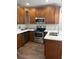 Well-equipped kitchen with stainless steel appliances and ample wood cabinetry at 2903 N 16Th St, Tampa, FL 33605