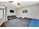 Spacious bedroom includes a ceiling fan, cozy seating, and a comfortable queen bed at 3044 Golden Rain Dr, Sarasota, FL 34232