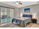 Bright bedroom with large window and neutral color scheme, plus a ceiling fan at 3044 Golden Rain Dr, Sarasota, FL 34232
