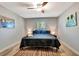 Inviting bedroom showcases natural light, calm colors, and a stylish ceiling fan at 3044 Golden Rain Dr, Sarasota, FL 34232