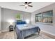 Comfortable bedroom features natural light, neutral walls, and ceiling fan at 3044 Golden Rain Dr, Sarasota, FL 34232