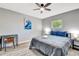 Cozy bedroom showcases a ceiling fan, side table lamps, and a calming grey color palette at 3044 Golden Rain Dr, Sarasota, FL 34232