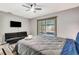 Serene bedroom includes a seating area, plush bed, and bright natural light at 3044 Golden Rain Dr, Sarasota, FL 34232