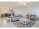 Inviting living room featuring neutral decor and large windows for natural light at 32091 S Pop Ash N Pl, San Antonio, FL 33576