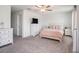 Comfortable main bedroom with neutral colors, a ceiling fan, and soft carpeting at 32091 S Pop Ash N Pl, San Antonio, FL 33576