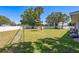 Expansive backyard with lush green grass and mature trees for shade and privacy at 3241 Brushwood Ct, Clearwater, FL 33761