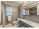 Bathroom with modern sink, vanity, mirror, stylish hardware, and great lighting at 3241 Brushwood Ct, Clearwater, FL 33761