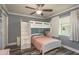 Stylish bedroom with bunk beds, wooden floors, great lighting, and a colorful window curtain at 3241 Brushwood Ct, Clearwater, FL 33761