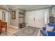 Inviting foyer with a light colored wood floor, coat rack, and stylish rug at 3241 Brushwood Ct, Clearwater, FL 33761
