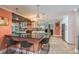 Spacious kitchen featuring black granite countertops, stainless steel appliances, and breakfast bar at 3241 Brushwood Ct, Clearwater, FL 33761