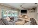 Stylish living room with a view of the pool through sliding glass doors at 3241 Brushwood Ct, Clearwater, FL 33761