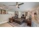 Open-concept living room with stylish furnishings, light wood floors, and view to dining area at 3241 Brushwood Ct, Clearwater, FL 33761