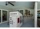 Covered patio with a playhouse and a window bar at 3241 Brushwood Ct, Clearwater, FL 33761