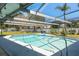 Sparkling pool with screened enclosure and tranquil outdoor living space at 3241 Brushwood Ct, Clearwater, FL 33761