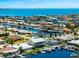 An aerial view of a waterfront community with canal access and numerous docks for boating at 3505 Seaway Dr, New Port Richey, FL 34652