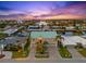 Waterfront home featuring a green roof, canal access, and a beautiful sunset backdrop in a coastal community at 3505 Seaway Dr, New Port Richey, FL 34652