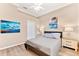 Bedroom featuring neutral walls, ceiling fan, and two side tables with lamps at 3505 Seaway Dr, New Port Richey, FL 34652