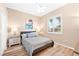 Bedroom with neutral walls, ceiling fan, and window with plantation shutters at 3505 Seaway Dr, New Port Richey, FL 34652