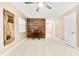 Bonus room featuring wood accent wall, light tile floors, and white walls at 3505 Seaway Dr, New Port Richey, FL 34652