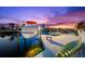 Waterfront property with boat lift, dock, and picturesque sunset views, enhancing its coastal charm at 3505 Seaway Dr, New Port Richey, FL 34652