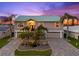 A two-story home with lush palms and a two-car garage, offering waterfront living at its finest at 3505 Seaway Dr, New Port Richey, FL 34652
