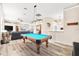 Bright game room with a pool table and an open floor plan for entertaining guests at 3505 Seaway Dr, New Port Richey, FL 34652