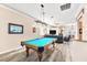 Spacious game room includes a bright blue pool table and open view into the living area at 3505 Seaway Dr, New Port Richey, FL 34652