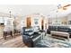 Bright living room features modern furniture, a ceiling fan and sleek flooring at 3505 Seaway Dr, New Port Richey, FL 34652