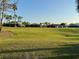 Scenic view of backyard, adjacent to green space and golf course at 446 Noble Faire Dr, Sun City Center, FL 33573