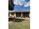 A single-story home with a well-maintained lawn and simple landscaping at 446 Noble Faire Dr, Sun City Center, FL 33573
