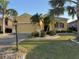 Charming single-Gathering home with well-manicured lawn and mature landscaping, offering curb appeal at 446 Noble Faire Dr, Sun City Center, FL 33573