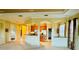 Open-concept kitchen with wood cabinetry and views to the living spaces at 446 Noble Faire Dr, Sun City Center, FL 33573