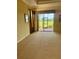 Bright living room featuring a sliding glass door with views of the outdoor area at 446 Noble Faire Dr, Sun City Center, FL 33573