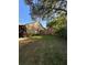 A great view of the backyard with a grass area, wood fence, and landscaping. Great for entertaining at 4504 Cabbage Palm Dr, Valrico, FL 33596