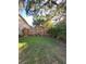 A private backyard with a wood fence, providing a secure space for outdoor enjoyment and relaxation at 4504 Cabbage Palm Dr, Valrico, FL 33596