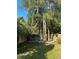 Well-maintained backyard featuring a lush green lawn and mature trees, providing ample shade and privacy at 4504 Cabbage Palm Dr, Valrico, FL 33596