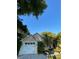 Inviting home exterior with a one-car garage, lush landscaping, and a bright blue sky backdrop at 4504 Cabbage Palm Dr, Valrico, FL 33596