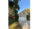 Charming home featuring a one-car garage, well-maintained lawn, and mature trees providing shade at 4504 Cabbage Palm Dr, Valrico, FL 33596
