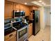 Modern kitchen with stainless steel appliances and granite countertops at 4504 Cabbage Palm Dr, Valrico, FL 33596
