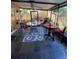 Enclosed patio featuring slate floors, ceiling fan and two tables with chairs at 4504 Cabbage Palm Dr, Valrico, FL 33596