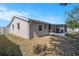 Backyard features a screened-in lanai, providing a serene outdoor retreat at 512 Red Mangrove Ln, Apollo Beach, FL 33572
