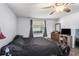 Bedroom featuring a ceiling fan, wood-look floors, and natural light at 512 Red Mangrove Ln, Apollo Beach, FL 33572