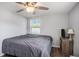 Bedroom featuring a ceiling fan, wood-look floors, and ample natural light at 512 Red Mangrove Ln, Apollo Beach, FL 33572