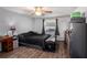 Bedroom featuring a ceiling fan, wood-look floors, and a window at 512 Red Mangrove Ln, Apollo Beach, FL 33572