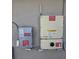 Solar panel system electrical box and components affixed to an exterior wall at 512 Red Mangrove Ln, Apollo Beach, FL 33572
