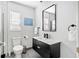 Bright bathroom with sleek vanity, modern fixtures, toilet, and stylish decor at 5519 Homewood Dr, Sarasota, FL 34232