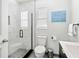 Bright bathroom featuring a glass shower with marble tile, modern toilet, and a stylish vanity at 5519 Homewood Dr, Sarasota, FL 34232